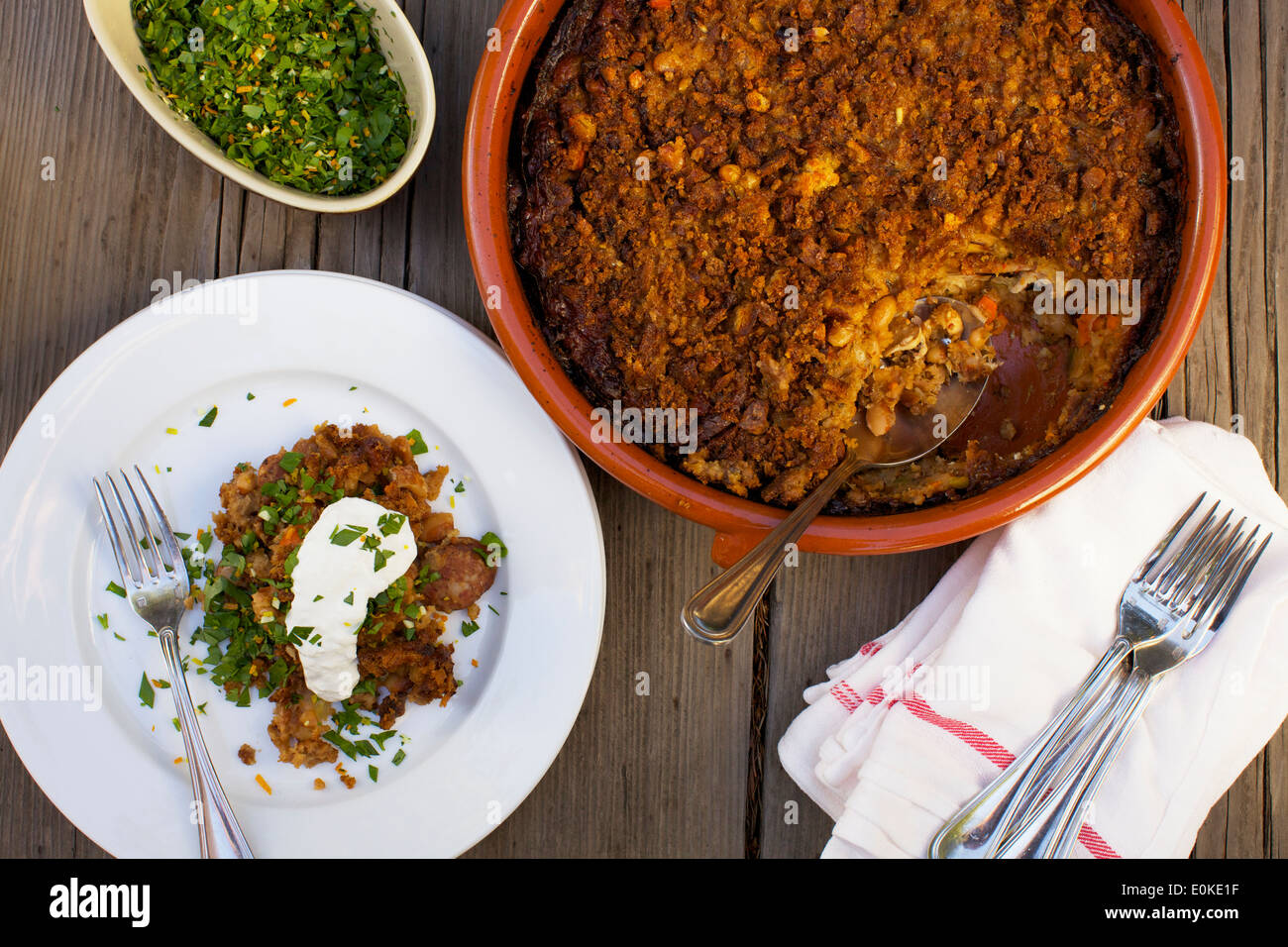 A single serving of casserole sits on a plate ready to be eaten, the