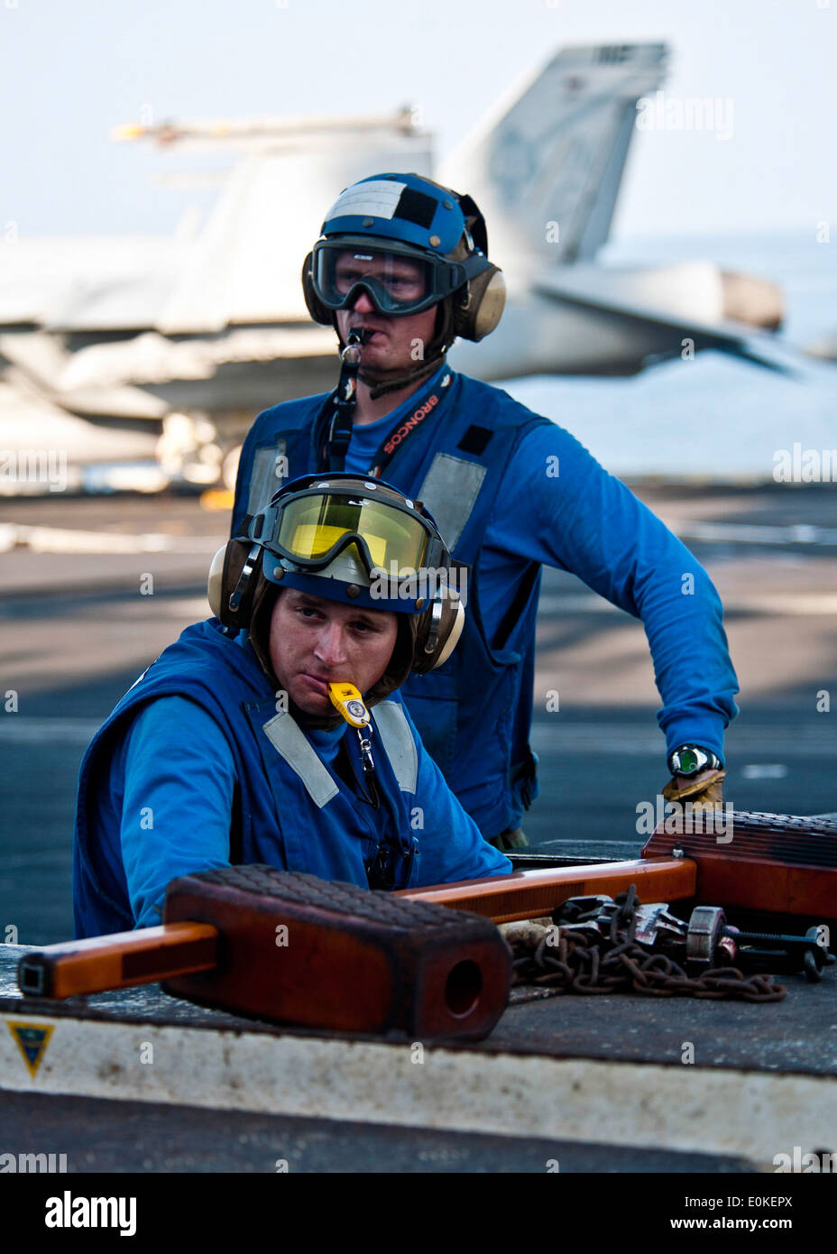 Aviation Boatswain’s Mate (Handling) Airman Adam Insley maneuvers an MH