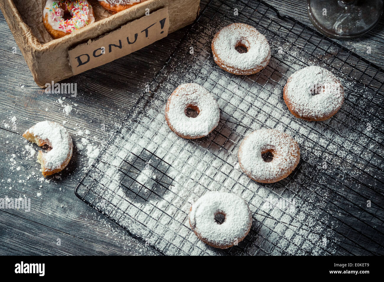 Tasting freshly baked donuts Stock Photo - Alamy