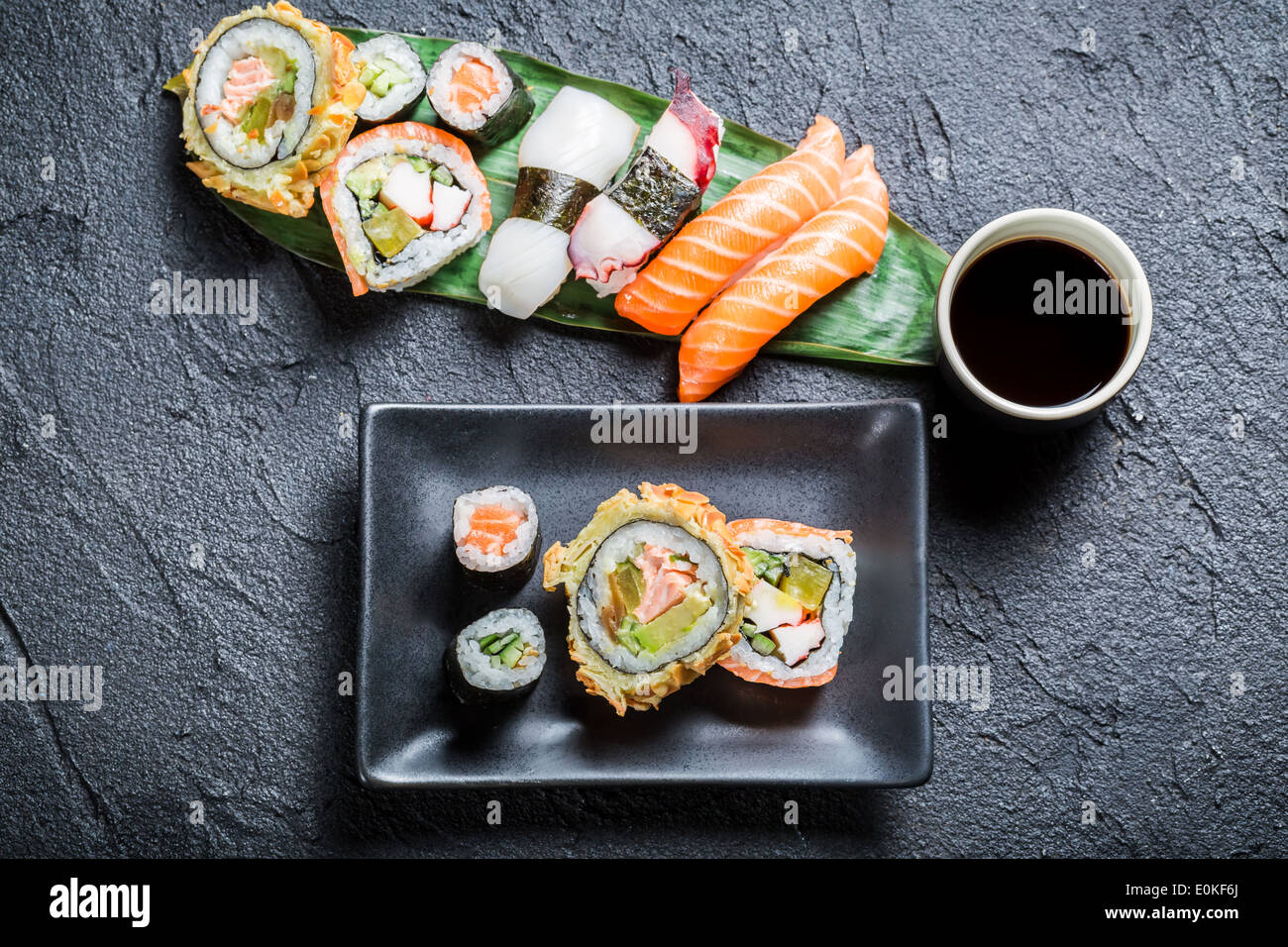 Sushi with soy sauce on black rock Stock Photo