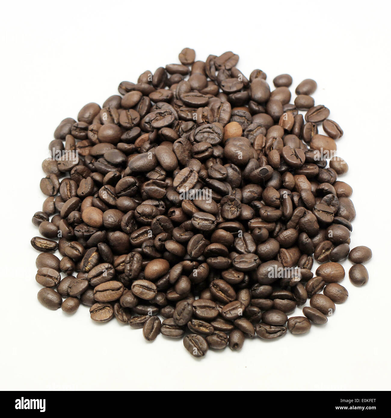 pile of coffee beans Isolated on white background Stock Photo - Alamy