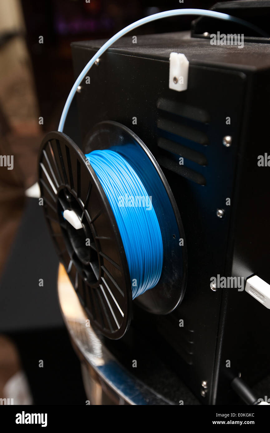 Spool of plastic thread feeding in to a 3D printer Stock Photo Alamy