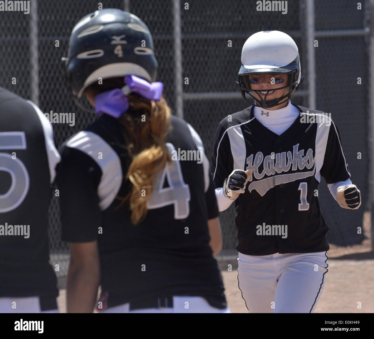 Usa. 14th May, 2014. SPORTS -- Volcano Vista's Chelsee Nunez, 1, greeted at home plate by her teammates after she hit an over-the-fence home run in the 5A state softball game against Cibola at Cleveland High School on Thursday, May 15, 2014.Volcano Vista won 9-5. © Greg Sorber/Albuquerque Journal/ZUMAPRESS.com/Alamy Live News Stock Photo