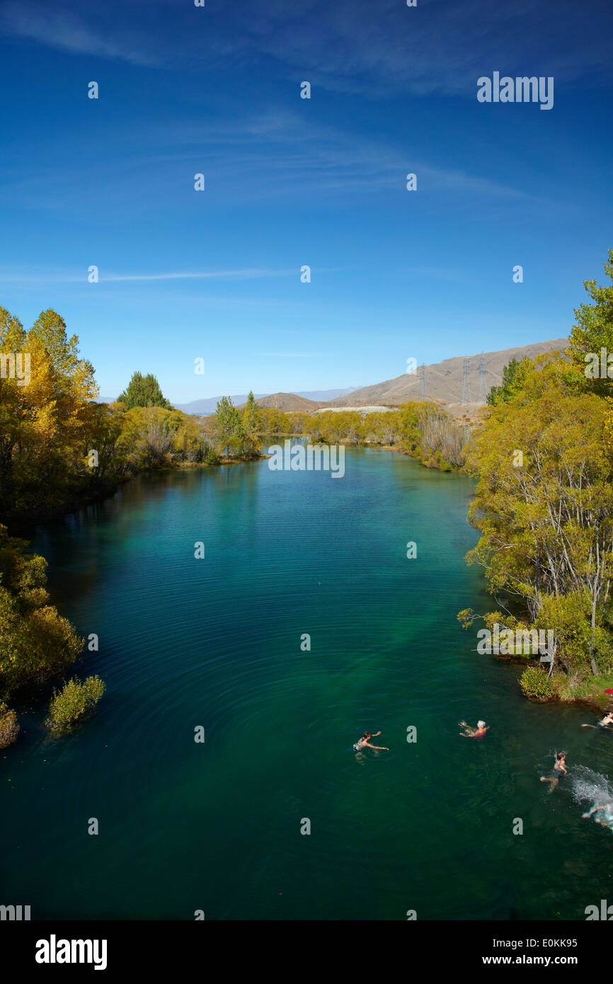 Swimmers and Ohau River in autumn, near Twizel, Mackenzie Country, South Island, New Zealand Stock Photo