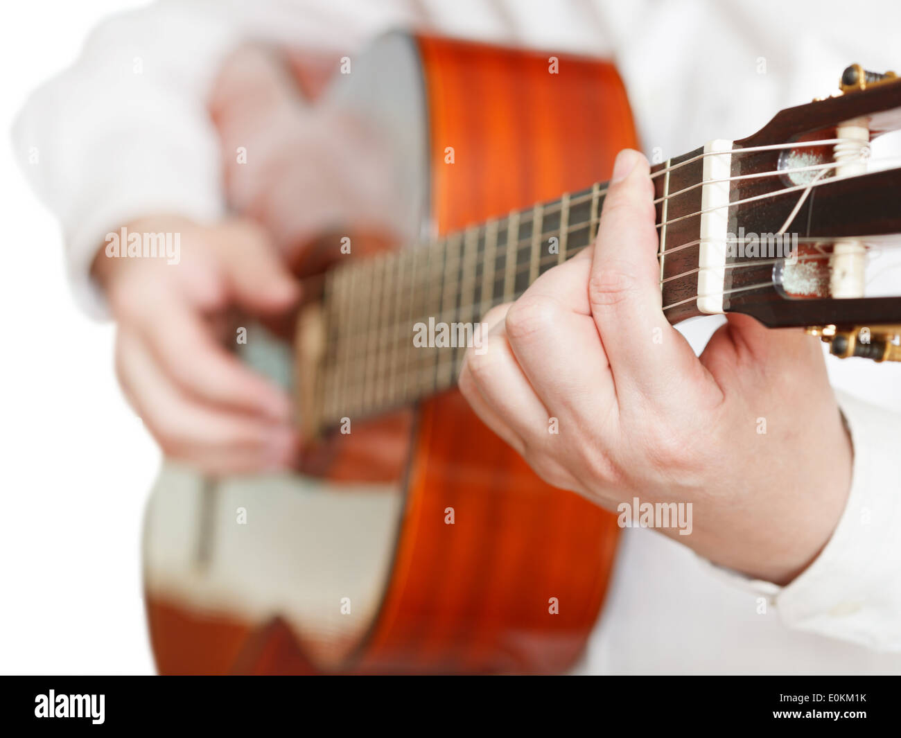 man playing classical guitar close up isolated on white background Stock Photo