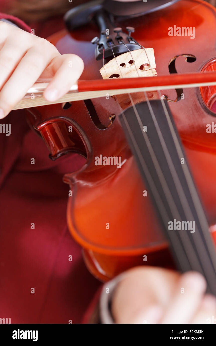 girl playing fiddle violin strings and bow close up Stock Photo Alamy