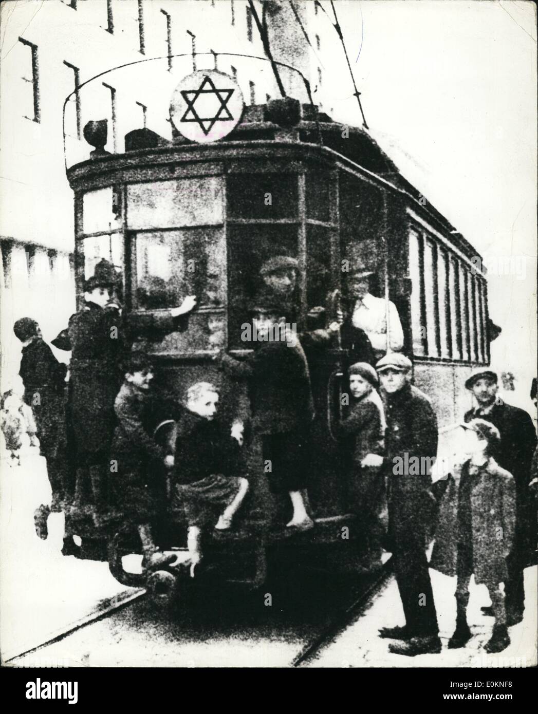 Jan. 1, 1930 - Ghetto Life In Warsaw - When Ghetto Still Existed: Warsaw, Poland. The War Of David Attached To The Top Of This Tram-Car Indicates It Is In Uses For Residents's Of Warsaw's Ghetto To Which Jews From Every Nazi Occupied Country Of Europe Has Been Sent. The Picture Was Publish In A Leading German Magazine And In Reache, London Via Neutral Channels. But Since This Picture Was Taken, The Warsaw Ghetto Has Ceased To Exist, Following The Ruthlessly Carried Out Plan Of Mass Slaught And The Total Population Of The Ghetto. (exact date unknown) Stock Photo