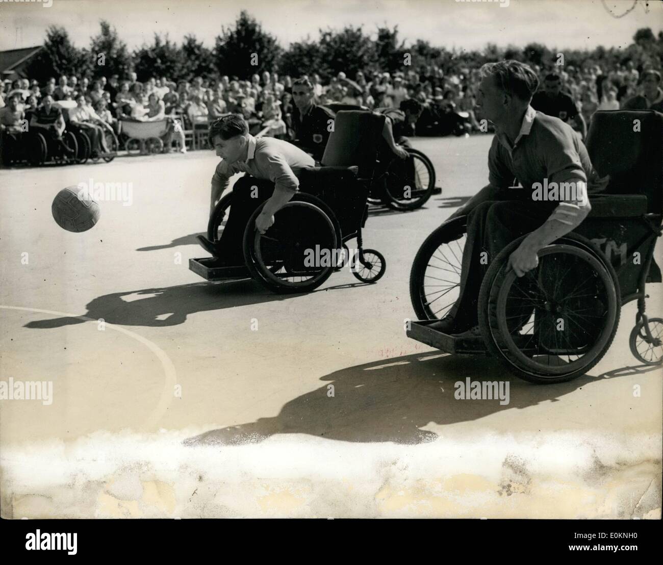 Jul. 07, 1930 - The ''Stoke Mandeville games'' at Aylesbury.: The annual Inter-Spinal Unit Sports Festival was held today at Stoke Mandevilee Hospital, near Ayslesbury, Bucks. Photo shows chasing after the ball in a game of net-ball organised by tow teams in wheelchairs. Stock Photo
