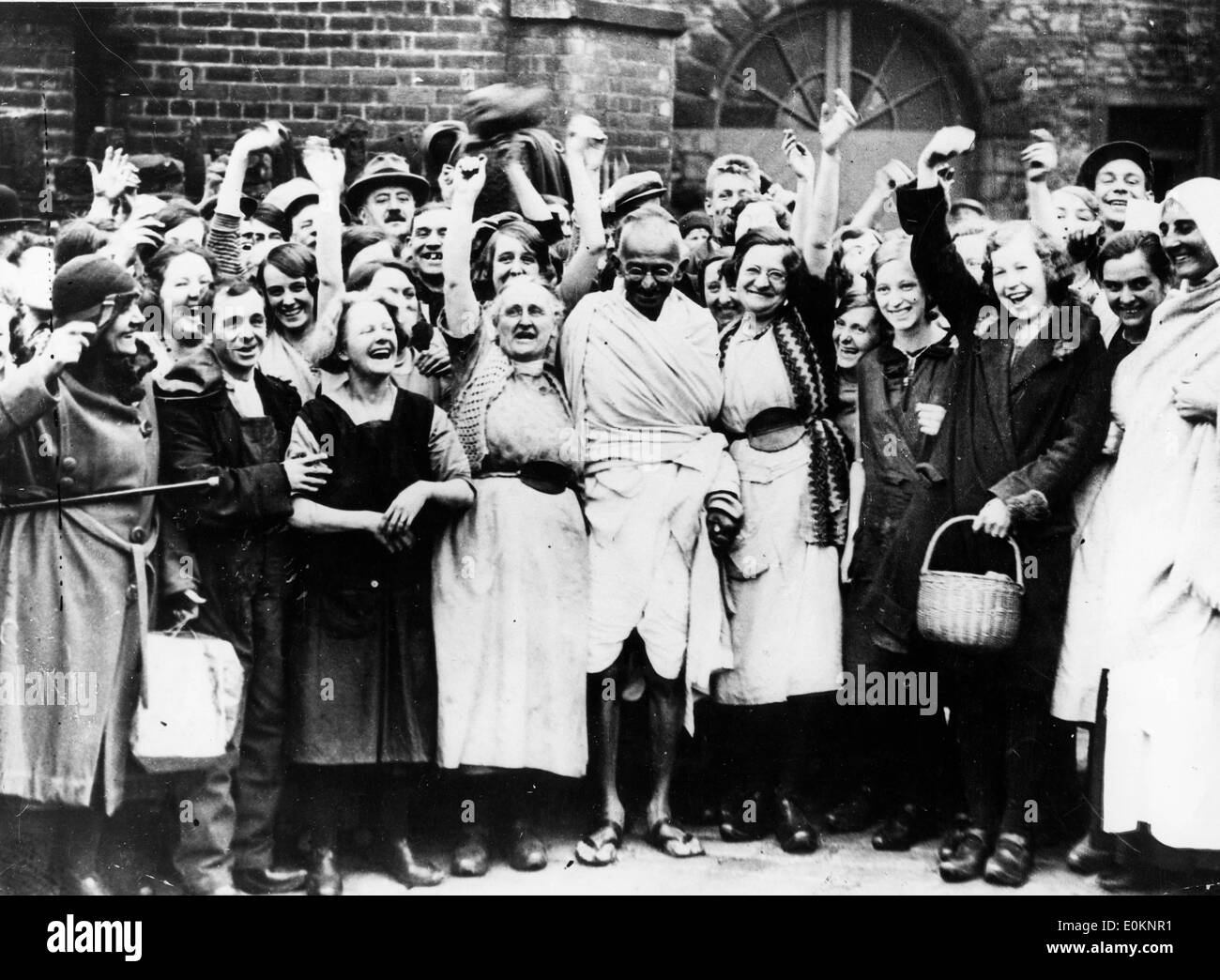 Mahatma Gandhi with a cheering crowd in London Stock Photo
