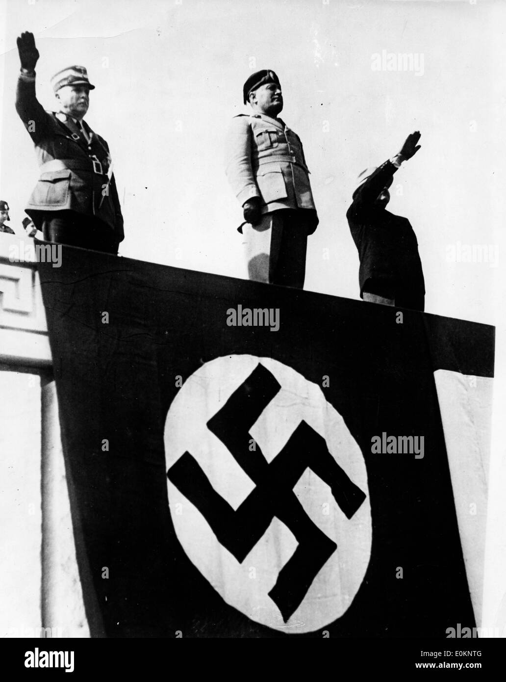 Dictator Benito Mussolini above swastika banner Stock Photo
