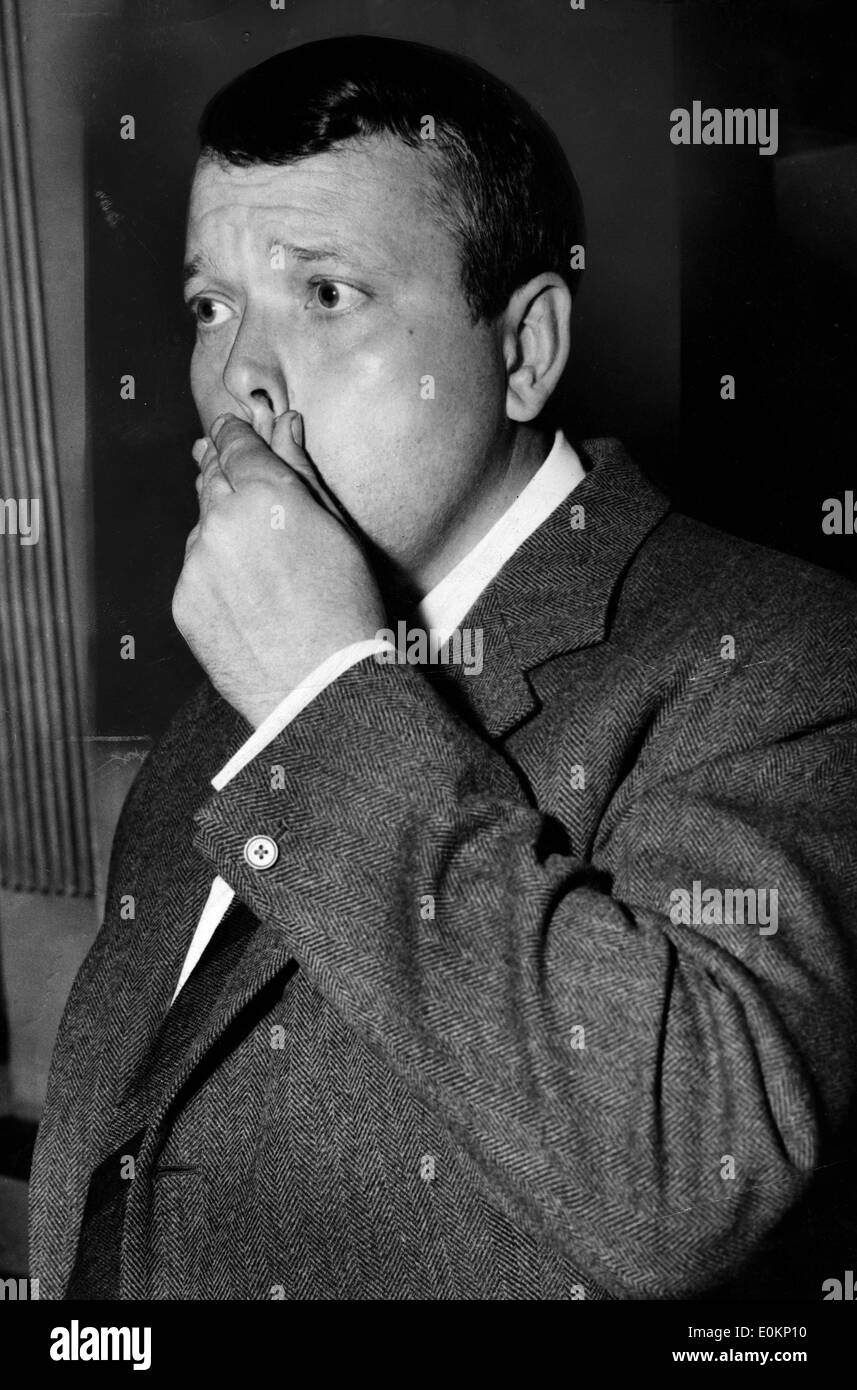 American actor George Orson Welles wiping his mouth Stock Photo