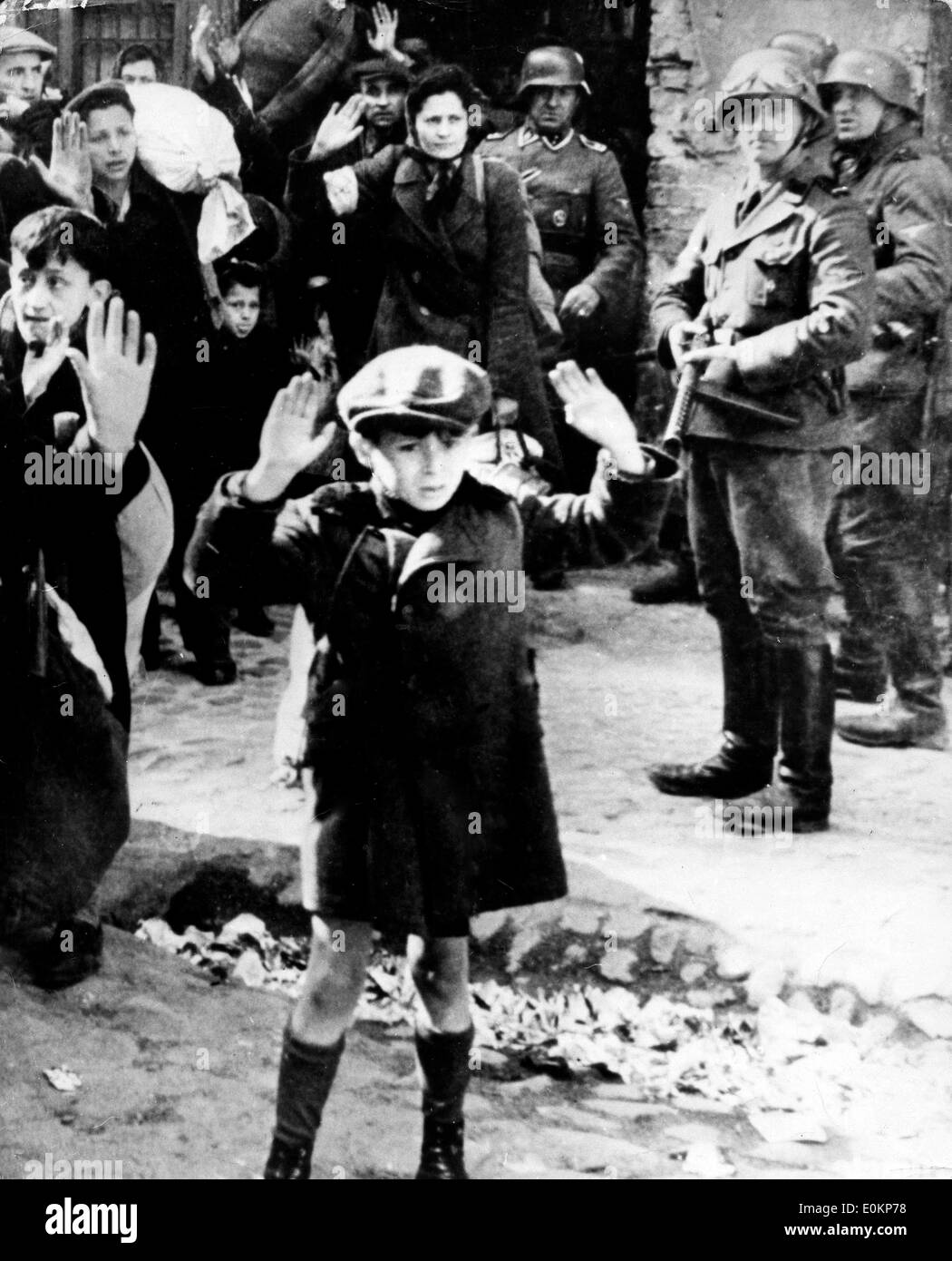 Boy in street with hands up during the Holocaust Stock Photo