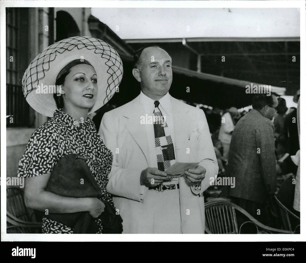 Jan. 01, 1936 - Producer and Bride on Honeymoon Miami, Fla. - Jack Warner, Hollywood producer, and his bride are shown here as they attended the opening day's race at the Hialeah Track today. Stock Photo