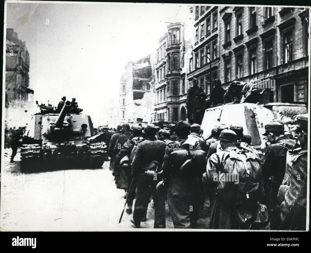 May 05, 1945 - German Soldiers pass Russian races on their way to prison camp. Stock Photo