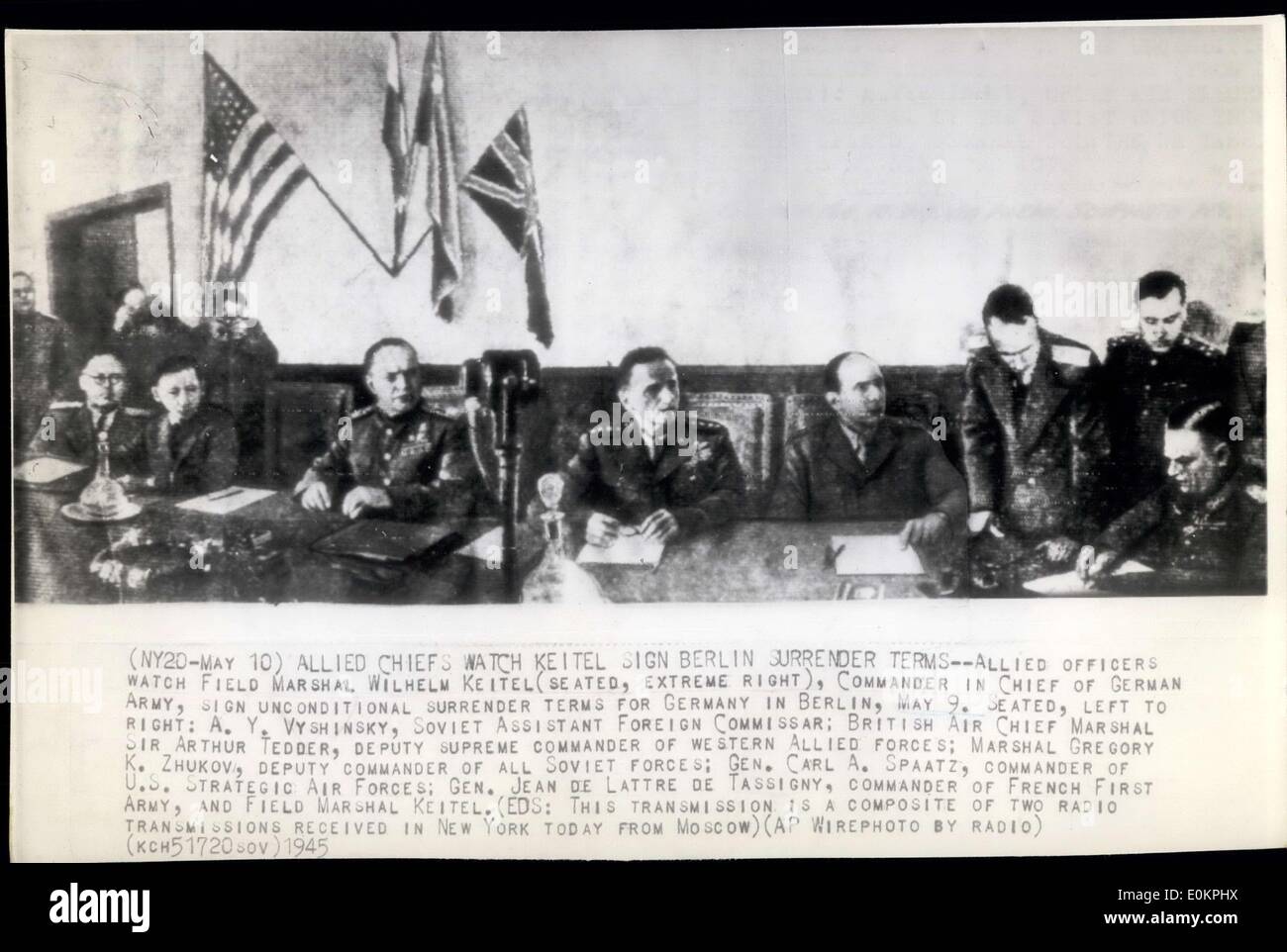 May 10, 1945 - Allied Chiefs Watch Keitel sign Berlin, surrender terms--Allied officers watch Field Marshal Wilhelm Keitel (seated, extreme right), Commander in Chief of German Army, Sign unconditional surrender terms for Germany in Berlin, May 9. Seated, left to right: A.Y. Vyshinsky, Soviet Assistant Foreign Commissar; British Air Chief MArshal, Sir Arthur Tedder, Deputy Supreme commander of Western Allied Forces; Marshal K. Zhukov, Deputy commander of all Soviet forcesl Gen. Carl A. Spaatz, commander of U Stock Photo