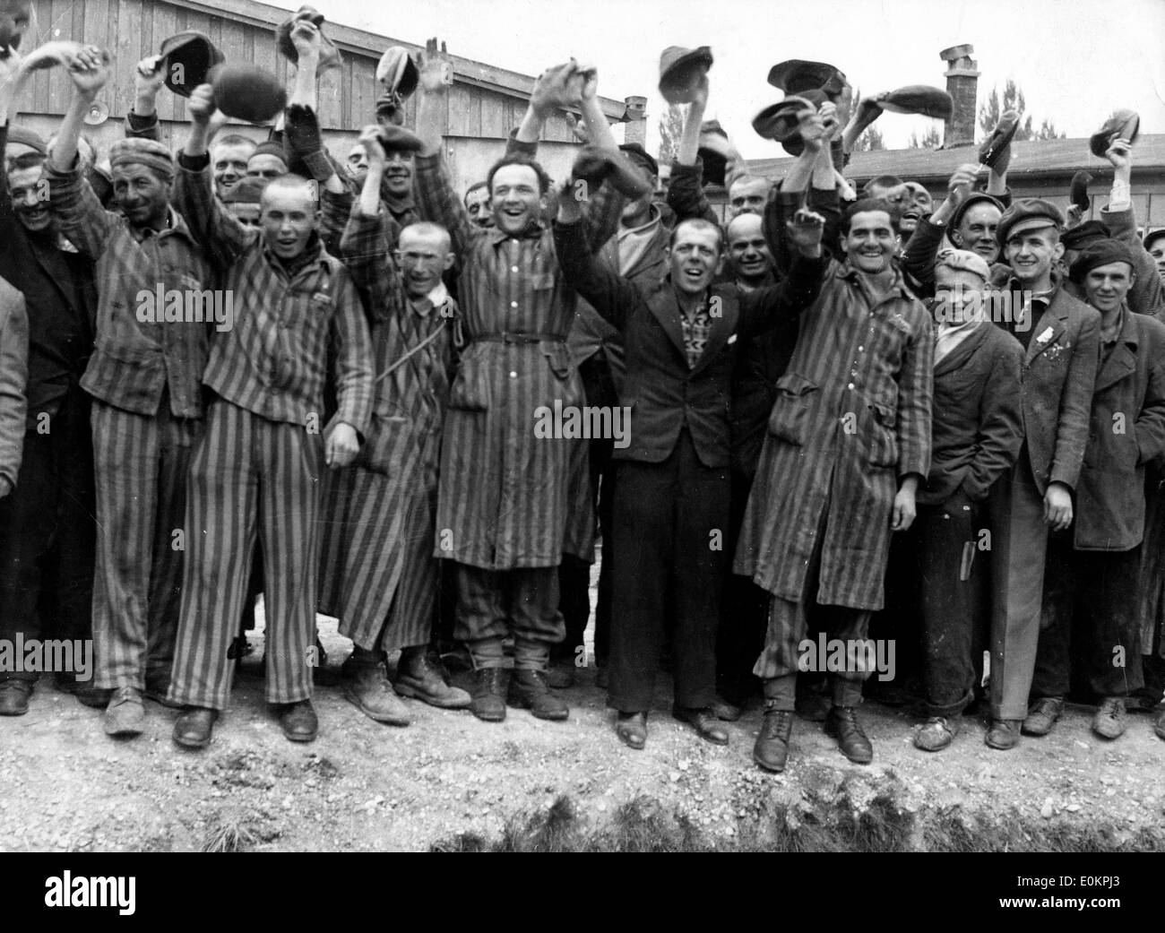 Political prisoners cheer madly as they hear guns of the 42nd Rainbow Division as they approach Dachau Stock Photo