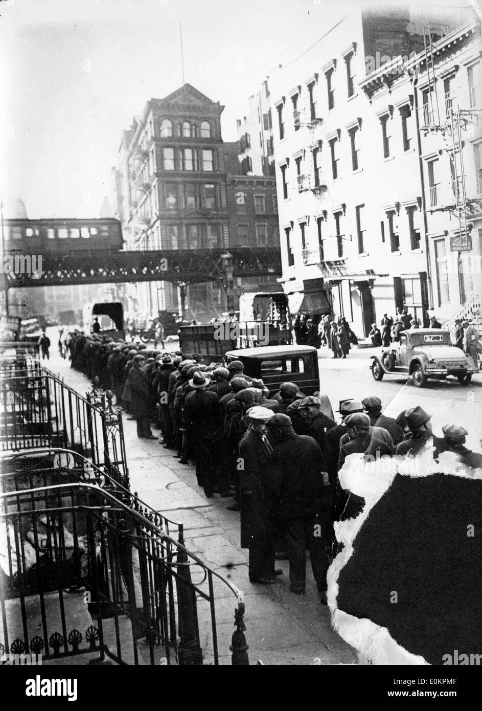 Unemployed people on the streets of New York during the Depression Stock Photo