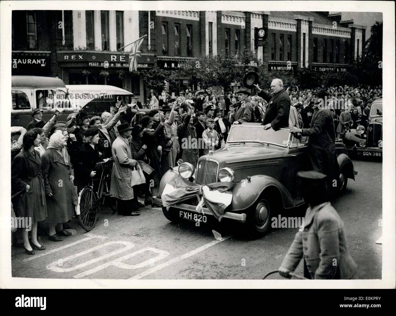Jun. 26, 1945 - Mr. Churchill in Manchester during his Election Campaign tour.: Photo shows The Prime Minister, Mr. Winston Churchill, acknowledges the cheering crowds with a wave of his hat. Stock Photo