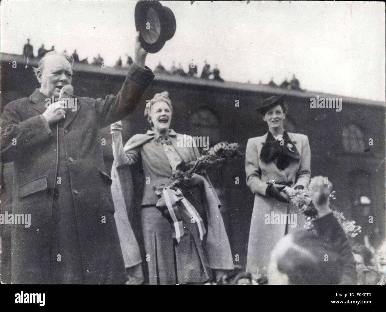 Jun. 26, 1945 - Mr. Churchill gives Election campaign Speech in Manchester. Photo shows Mr. Churchill waves his hat in acknowledgement of the cheers from the crowd. Mrs. Churchill also waves hand. Stock Photo