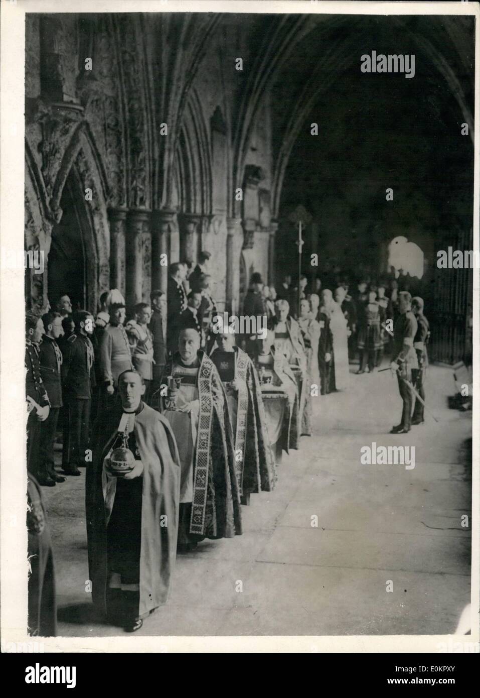 Dec. 12, 1937 - 12-5-37 Regalia carried in procession to the coronation ceremony. The priceless Royal regalia was carried in procession through the cloisters of Westminster Abbey from the Jerusalem Chamber to the High Altar for the Coronation ceremony. OPS: The crowns photographed being carried in the regalia procession today. Stock Photo