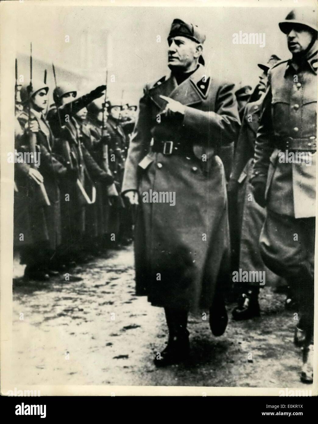 Apr. 08, 1938 - Mussolini In Limelight Again: II Duce appears occasionally on pages of German magazines and newspapers, when it Nazis deen it wise to give publicity to their Fascist Colleagues. Photo Shows Here is Mussolini inspecting Italian Fascist troops during is visit to Milan. Stock Photo