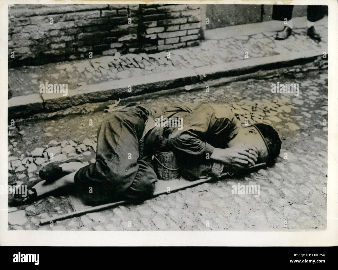 Jun. 06, 1946 - Starvation In China!!!!! End Of A Fruitless Search For Food: An aged Chinese,who had walked as as he could he search for food, sinks to the ground, exhausted -too weak to go any further. The soup can be carries, is till empty, lying under his body, Such tragedies are an everyday occurrences in China's famine area. Stock Photo