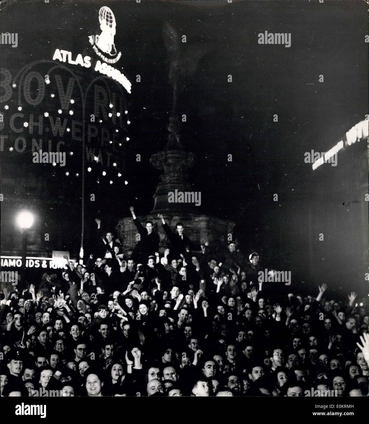 Apr. 02, 1949 - The Lights Go on Again. FIrst Time for ten years. Extra Police Posted to the Piccadilly area. Photo shows Cheering crowds gathered round Eros, as the lights went up in Picadilly Circus tonight. Stock Photo