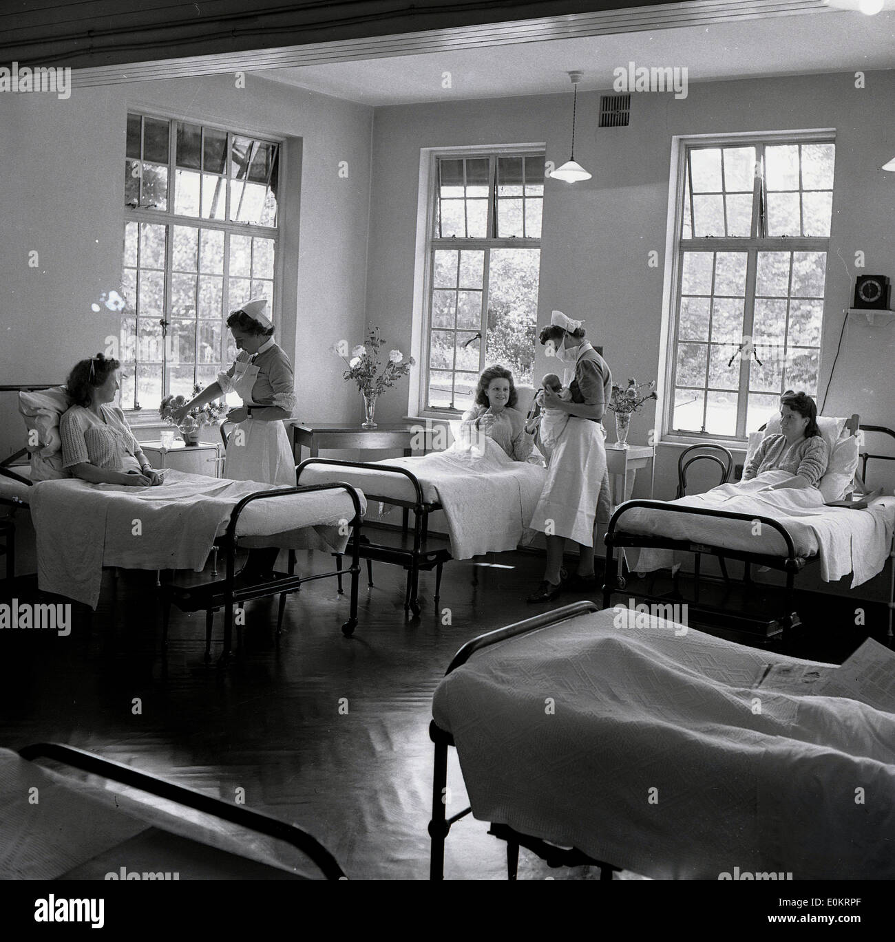 1950s historical. A bright, welllit hospital maternity room with
