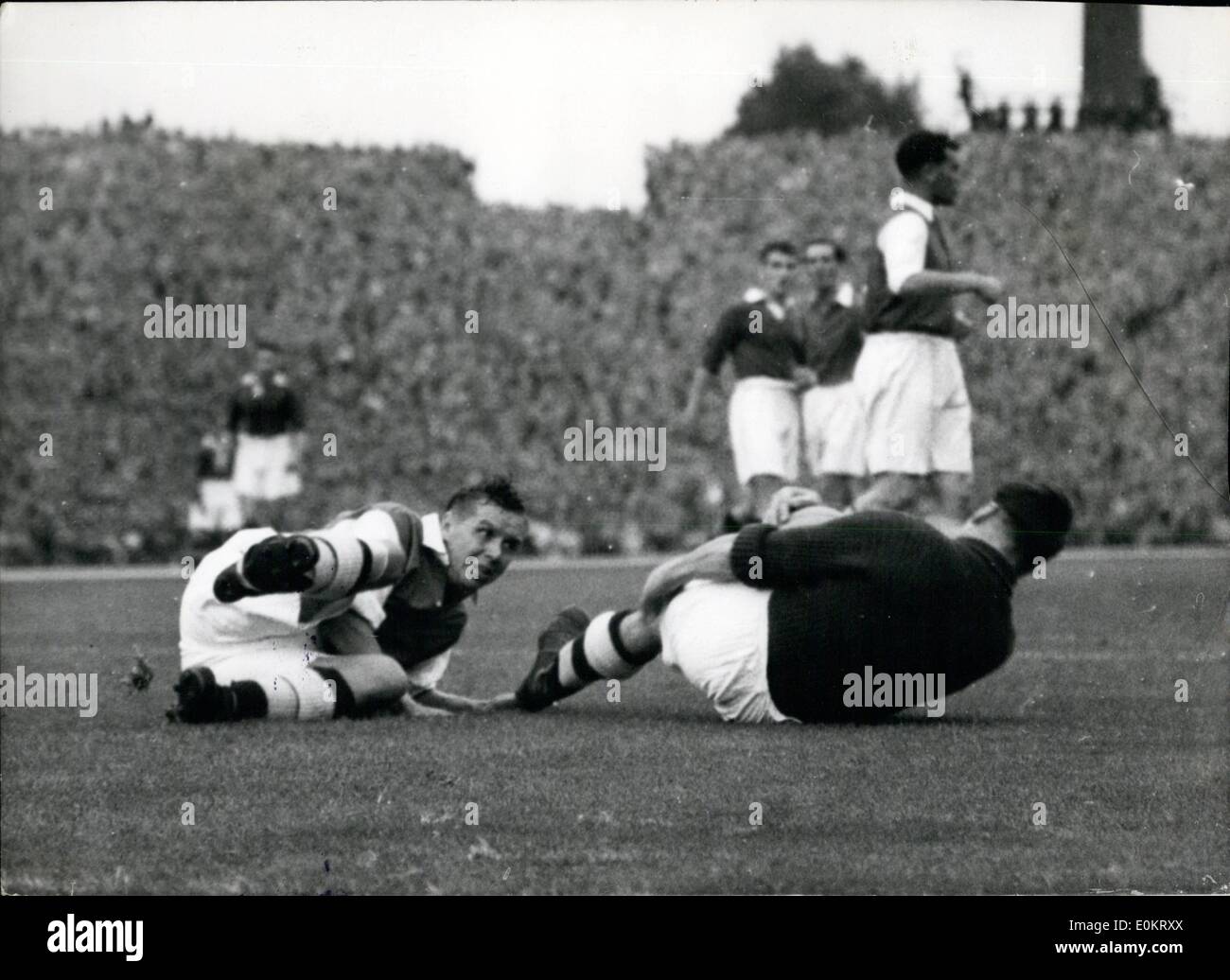 Aug. 08, 1949 - Arsenal V Chelsea at Highbury : photo shows Swindon, the arsenal goalkeeper, and Laurie Scott, the arsenal right - back, collided whilst defending their goal. this evening. Stock Photo