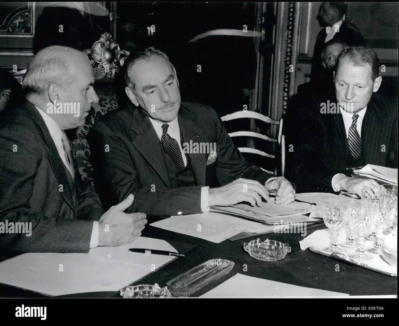 Nov. 11, 1949 - New agreement reached on the German problem. Foreign Ministers attend Paris conference.: Mr. Bevin; Mr. Deanh Acheson and M. Schuman the Foreign Ministers of Britain - France and the United States, reached a final agreement on a new an more liberal policy towards the West German Federal Republic.Decisions are to be made to Germany including a revision of the dismantling programme in return for guarantees of good faith by the Bonn Government. Photo shows during the Conference - from left to right: - McCloy; Mr. Acheson and Mr. Perkins signing at the Queen D'Orsay. Stock Photo