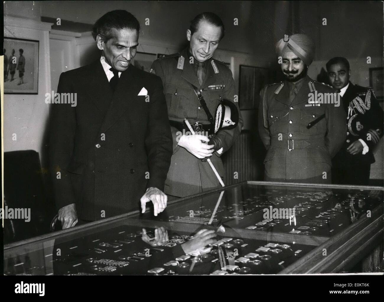 Jan. 01, 1950 - High Commissioner for India presents Medals at Ceremonial Parade at Sandburst.: Mr. Krishna enon, the high Commissioner for India today attended the ceremonial parade at the Royal Military Academy, Sandburst, where he presented a collection of Indian medals, of the Indian Army dated from 1784 - 1945 which were a gift from the Government of India. Photo shows Mr. Krishna Menon, at high Commissioner for India, pointing out interesting medals from the collection to Major - Gen. Sir Hugh Stockwell, K. B. E., C. B., D. S. O Stock Photo