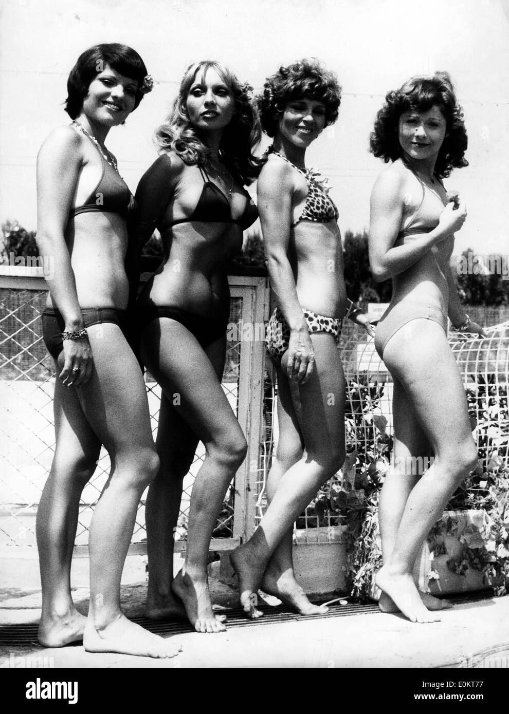Jan. 01, 1950 - L - File Photo: circa 1940s-1950s, location unknown. Girls posing in bikini's in fashion shows, shoots and on beaches tanning. According to the official version, the modern bikini was invented by French engineer Louis Rekard and fashion designer Jacques Heim in Paris in 1946 and introduced on July 5 at a fashion show at Piscine Molitor in Paris. It was a string bikini with a g-string back Stock Photo
