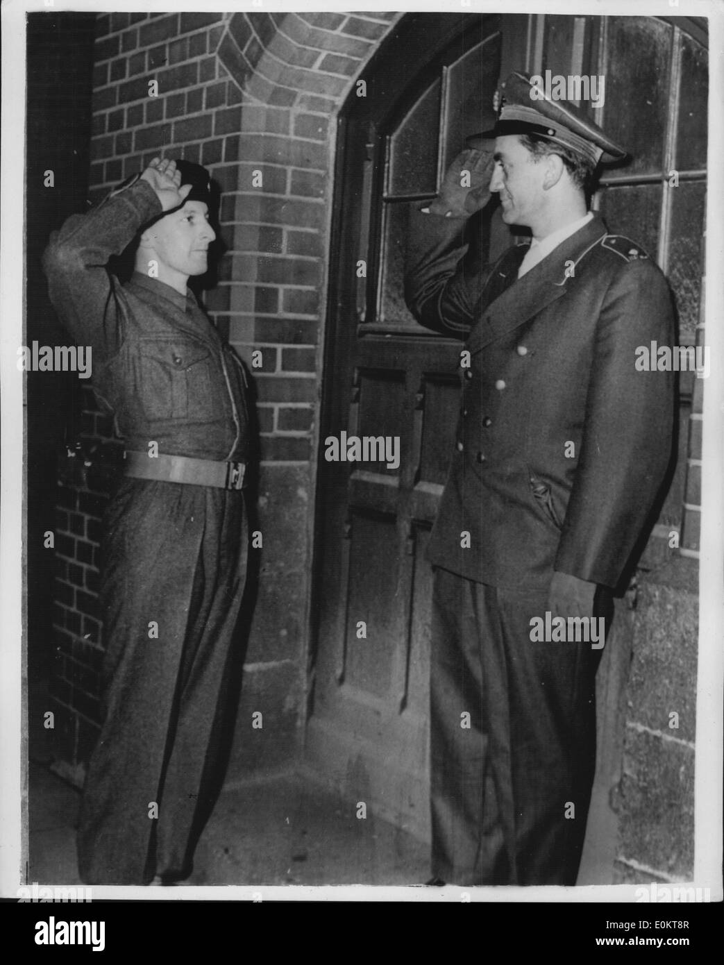 Jan 1, 1950 - British Soldier Salutes Officer Of The New German Army. First Pictures: Photo shows CPL S. J. Walters, of the 1st. South Wales Borderers, saluting an officer (Major), of the new German Army, in the strets of Bonn this evening. This is the first picture of an Allied soldier saluting a new German officer. (exact date unknown) Stock Photo