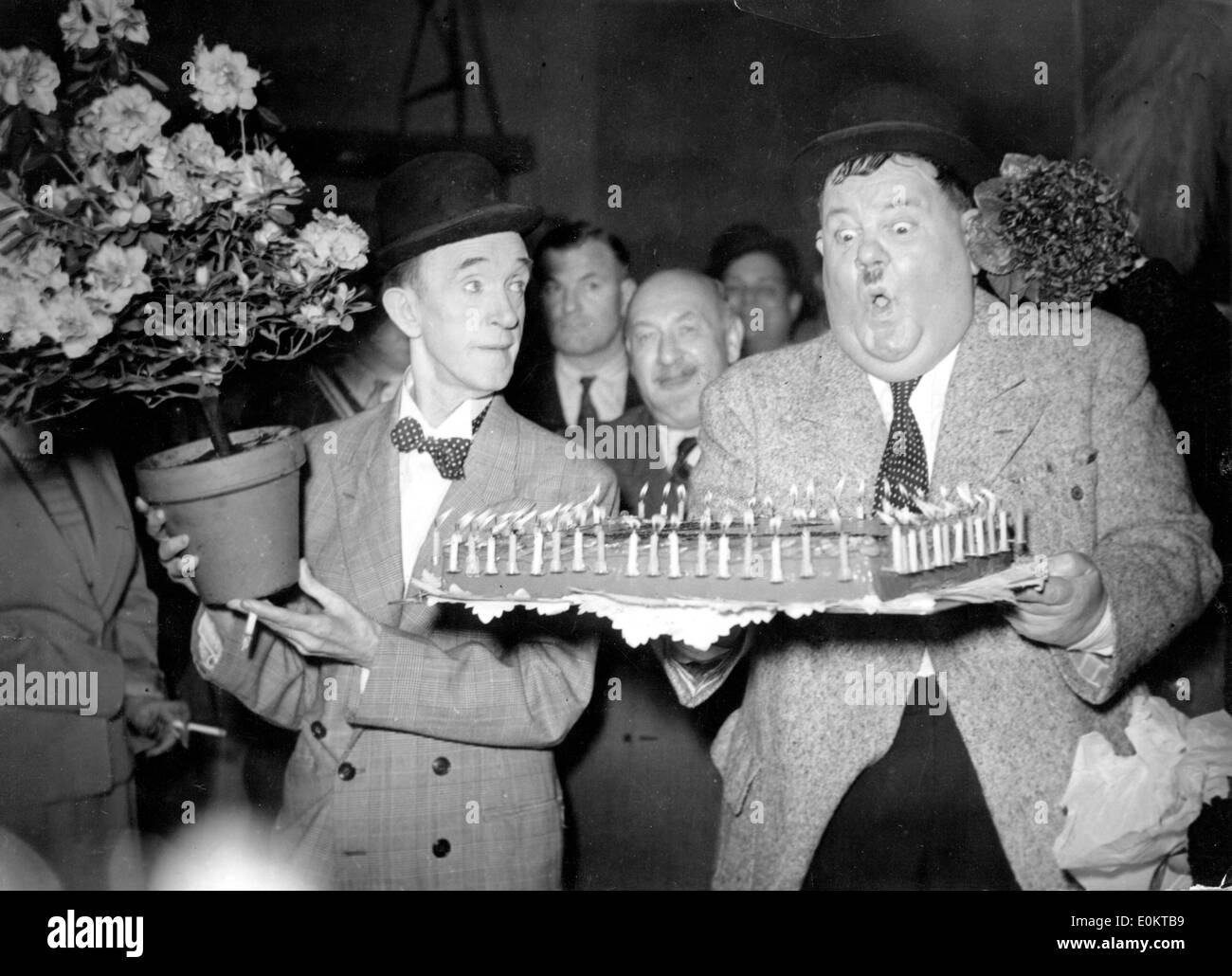 Comedians Stan Laurel and Oliver Hardy at a birthday party Stock Photo