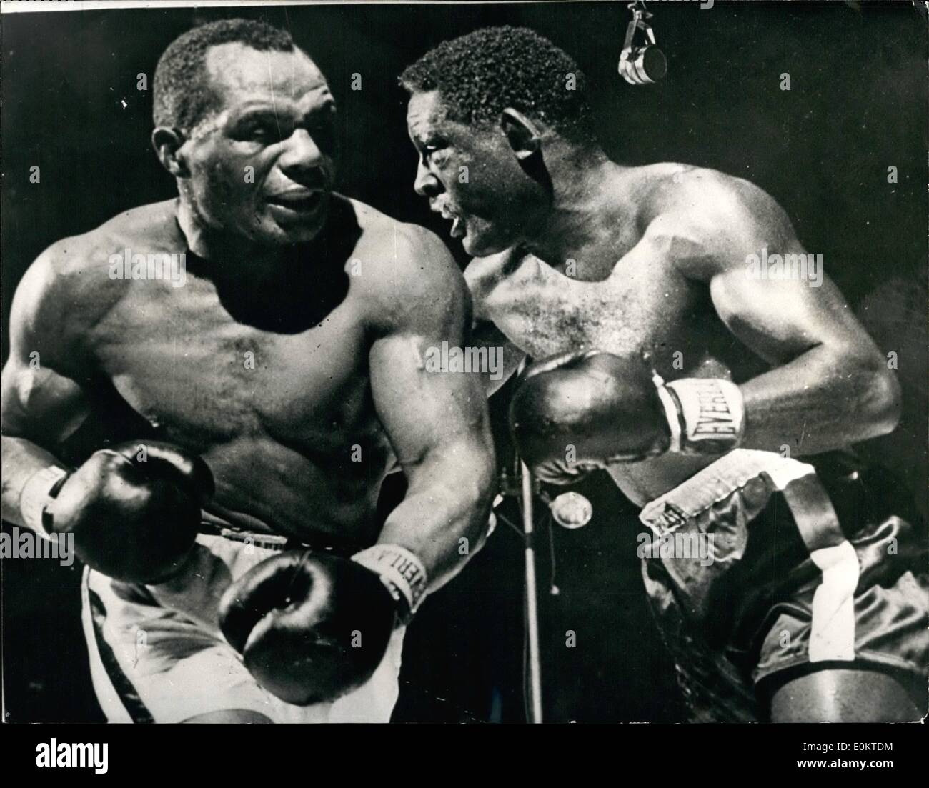 Mar. 03, 1951 - Ezzard Charles defeats Joe Walcott on Points..Fifteen round contest in Detroit: Photo Shows Ezzard Charles (right) and Jersey Joe Walcott seen during their fifteen round contest at the Olympia Stadium, Detroit, Mich...Charles won the contest on points - thus retaining his title. Stock Photo