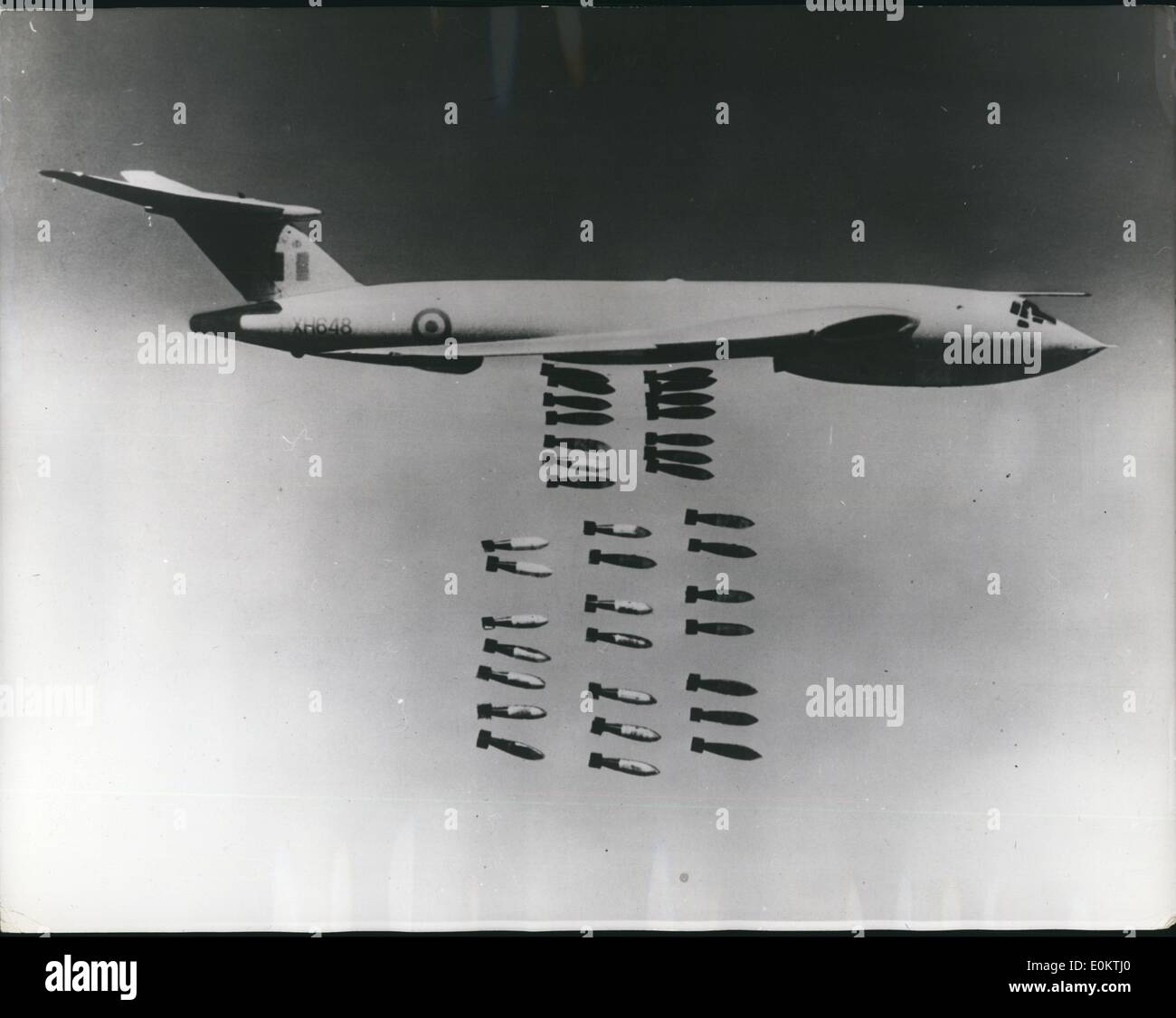 Jan 1, 1950 - British official photograph (Royal air force) crown copyright reserved: Royal air force - ready for action anywhere down go the 1,000 pounders from the 'Victor': As recently revealed, a further elements of royal air force bomber command a V-force is in a state of readiness to go to the far east if necessary to support Malaysia against Indonesian confrontation. Besides their nuclear role, the v. bombers can operate with orthodox high explosive bombs. Here a Victor is seen dropping 35 1,000 pounders during practice. (exact date unknown) Stock Photo