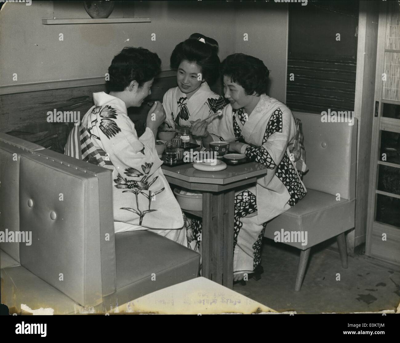 Jan 1, 1950 - Geisha girls have a chat over a meal before the evenings entertainment starts. Off duty they wear simple Kimonos and dispense with their wigs, although one of them her own long hair dressed in traditional fashion. The ''Illegible'' have had their hair ''Permed' (exact date unknown) Stock Photo
