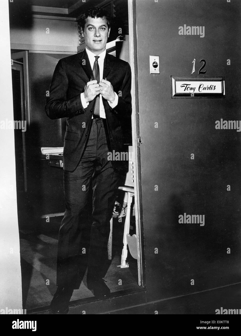 Actor Tony Curtis coming out of his dressing room Stock Photo