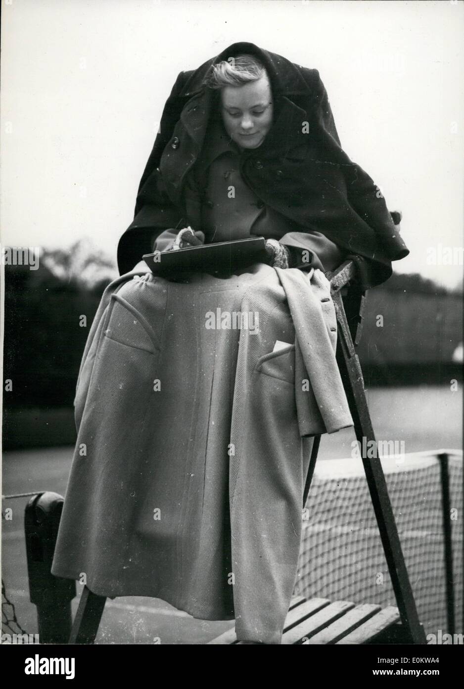 Apr. 24, 1950 - 24-4-50 Fourteen year old umpire well protected against the April weather at tennis tournament Ã¢â‚¬â€œ Play in Stock Photo