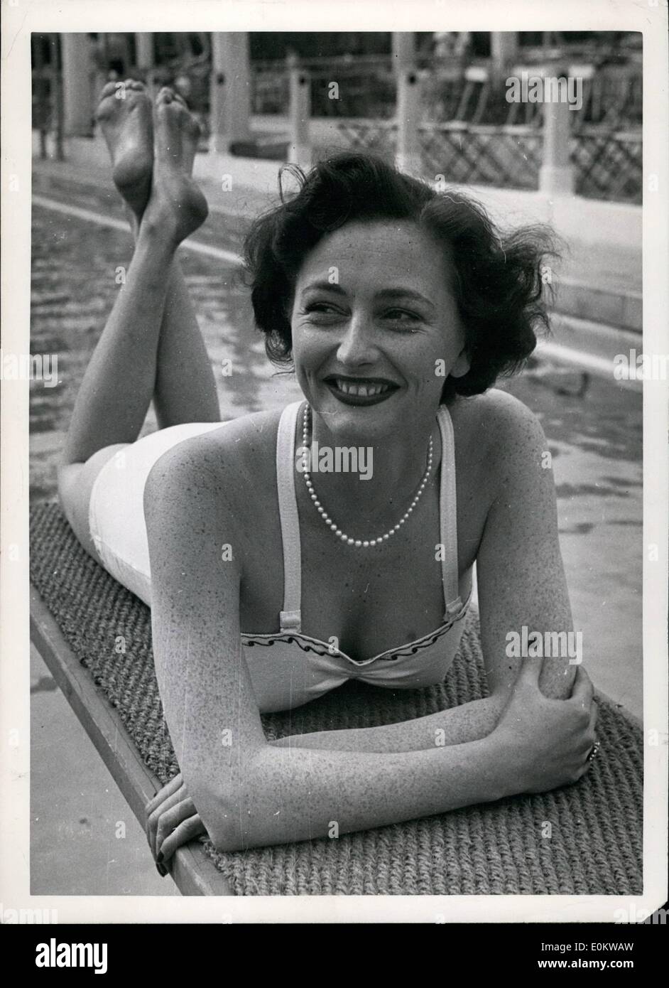 May 05, 1950 - Basking - In The Limelight: Actress Daphne Arthur basked in the sun - and the limelight - yesterday afternoon. She has just won a theatrical award for the year's best performance in a supporting role. She played Margaret in ''The Holly and the Ivy'' at the Duchess Theatre, London. But while she relaxed at the swimming pool, Daphne recalled the days when she had to give swimming lessons to help make ends meet. Stock Photo