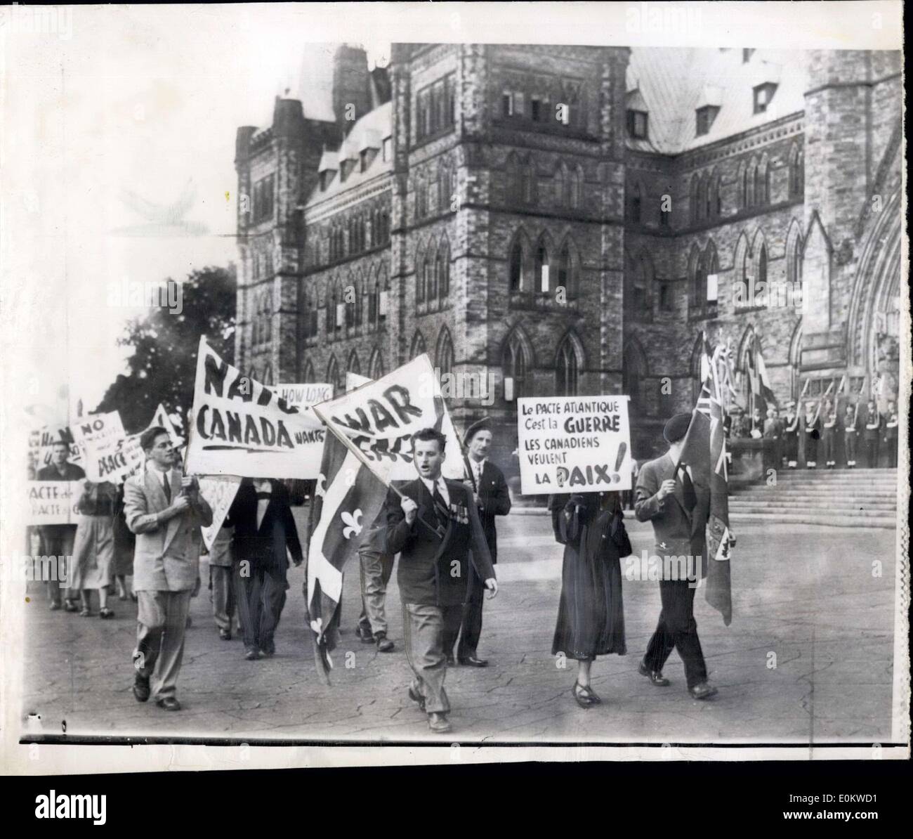 Sep. 15, 1951 - Picketing Nato opening;Pickets parade in front of the Parliament buildings this afternoon protesting the North Atlantic Peace Act opening. Some pickets shouted.. ''Yanks Go home'' and ''We don't want war' Stock Photo