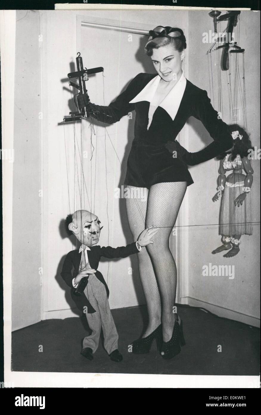 Oct. 10, 1951 - Puppets to Pantomime. Rene Strange used to be famous for her puppets - but when Rene took her puppets on Television most viewers were in a quandary. Some found her logs distracted their attention from the puppets, which always ''not'' on the floor. And while the cameras were focused on them, there was no avoiding the legs in the glamorous black net stockings. Soon there will be a chance for people to see whether the rest of the Rene shapes up to the promise of her legs - for she is to be Principal Boy in a production of the pantomime ''Mother Goose'' at Christmas Stock Photo
