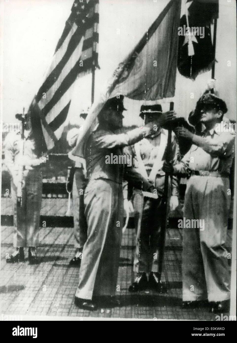 Jul. 17, 1950 - General Douglas MacArthur Receive United Nations Flag. OPS: Picture just received shows General J. Lawton Collins (left) presenting the United Nations flag to General Douglas MacArthur (right), on the roof of the Dai Ichi building in Tokyo, MacArthur's headquarters. Stock Photo