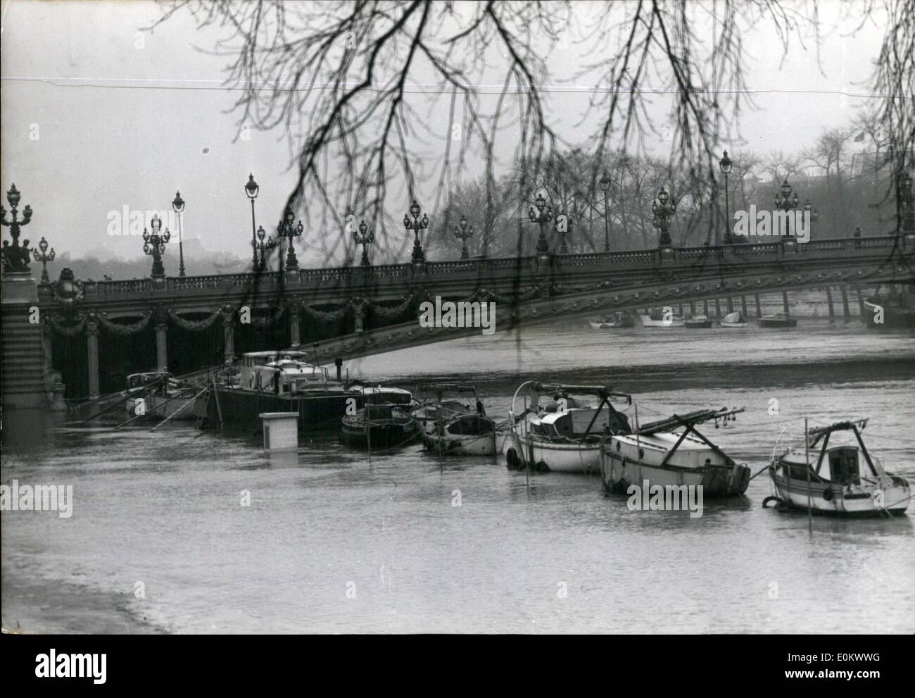 Jan. 01, 1952 - Floods in Paris : Pleasure boats moored alongside the quay under the Alexander III bridge are in the middle of the seine and cannot be reached from the flooded banks. Stock Photo