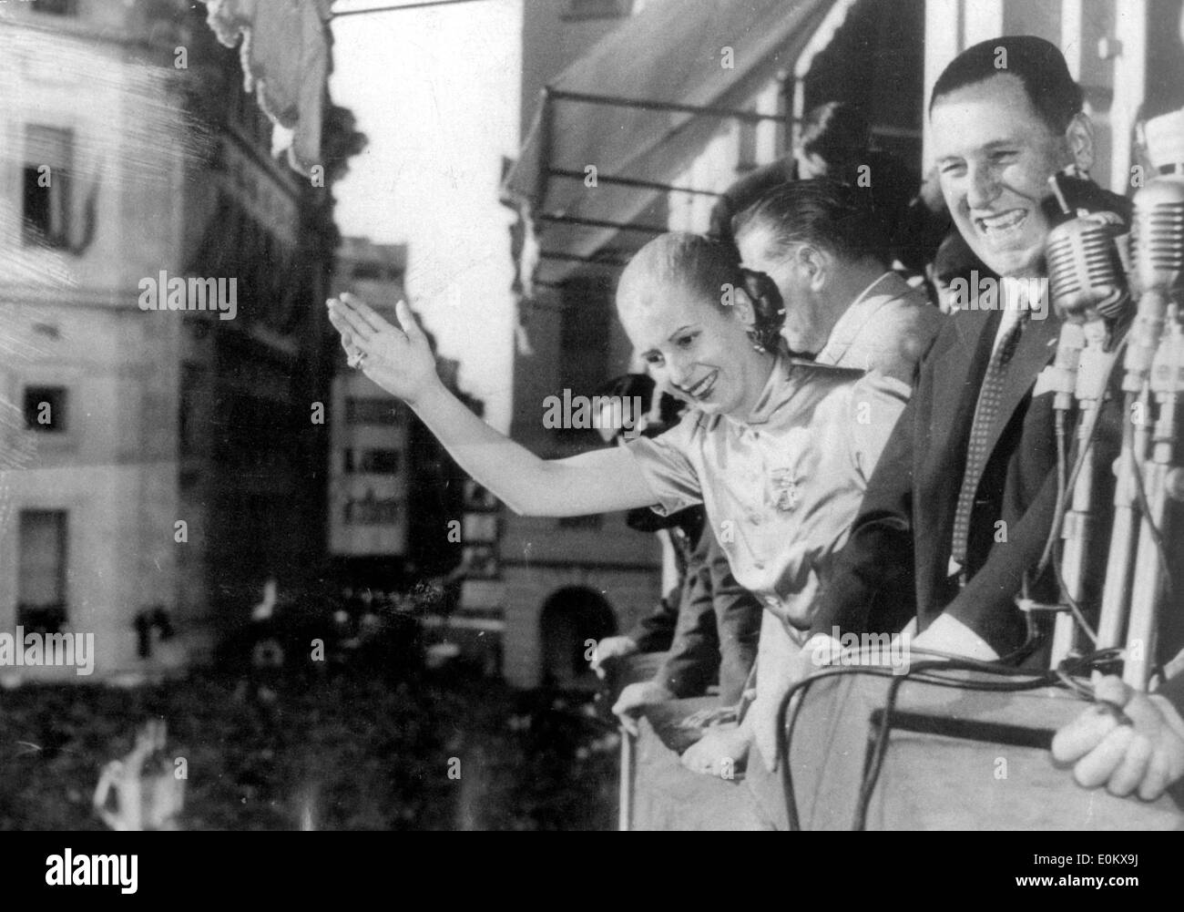 President Juan Peron and his wife Evita wave from a balcony Stock Photo