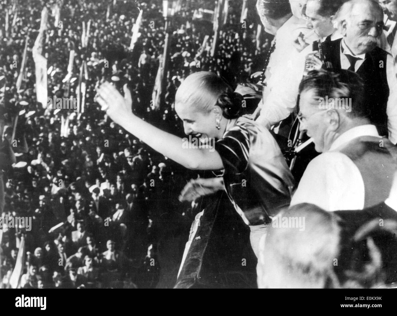 President Juan Peron and his wife Evita wave from a balcony Stock Photo