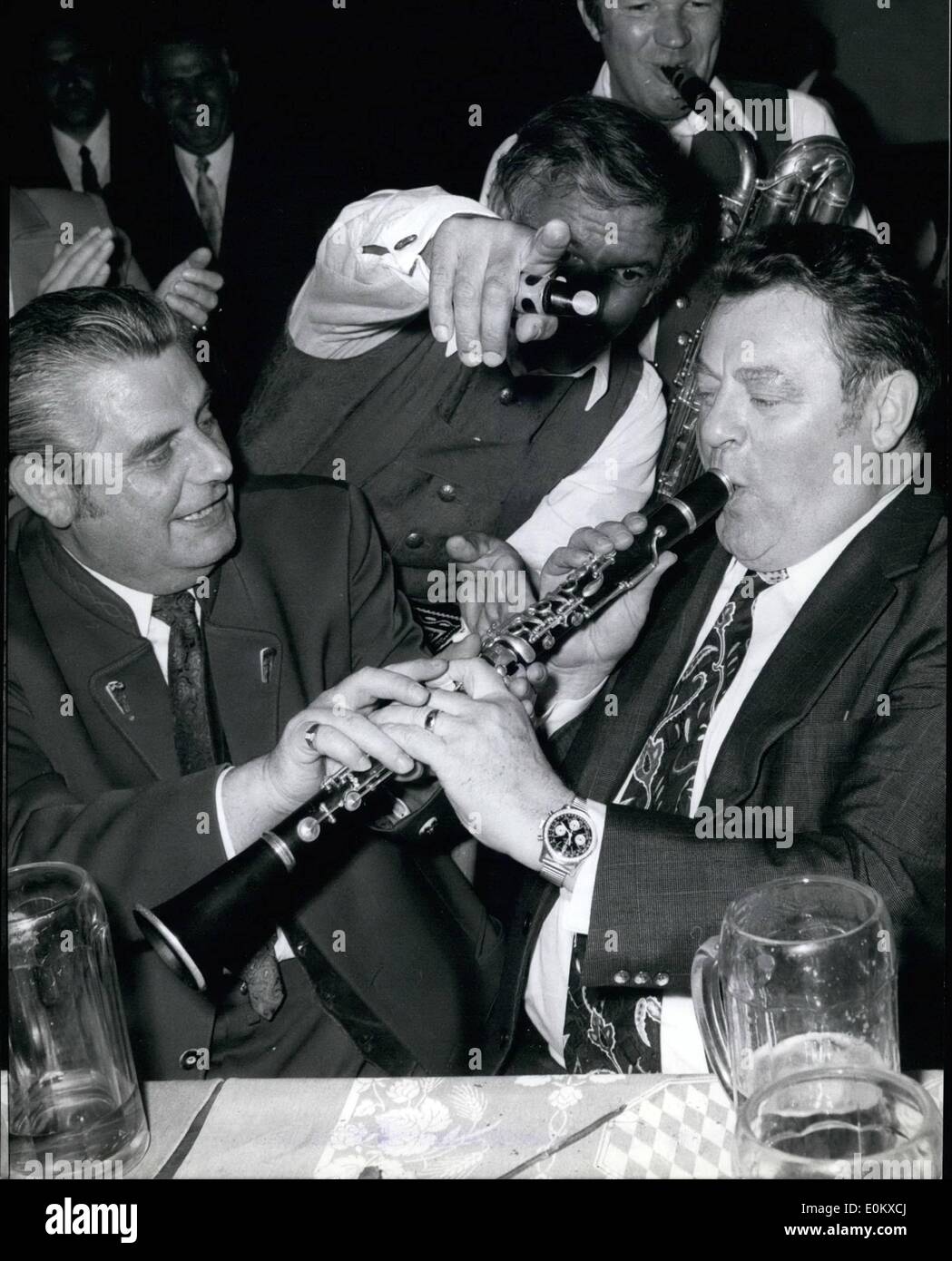 May 05, 1952 - Franz Josef Strauss: chairman of the Christian Social Union in West Germany dropped in at the famous beer hall '' Horbrauhaus'' in Munich last night, where he was taught how to play the clatinet. Critically watched by the band and his party friend Georg Loibl (left), he made a few tries oven managed to get some notes if the intstrument. Stock Photo