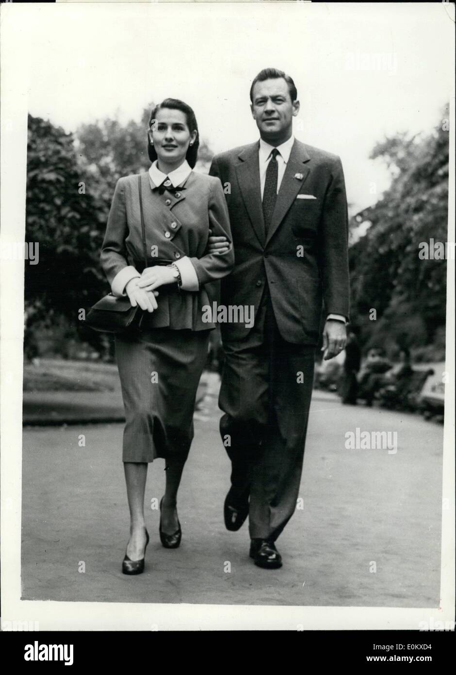 May 05, 1952 - ''Mr. and Mrs.Dreamboat'' in London. William Holden and his wife.: William Holden the Hollywood screen star and his wife who have been given the name ''Mr. and Mrs Dreamboat'' by Hollywood Boobysoxers - arrived in London yesterday. Photo shows Mr. and Mrs. William Holden seen walking in London this morning. Stock Photo