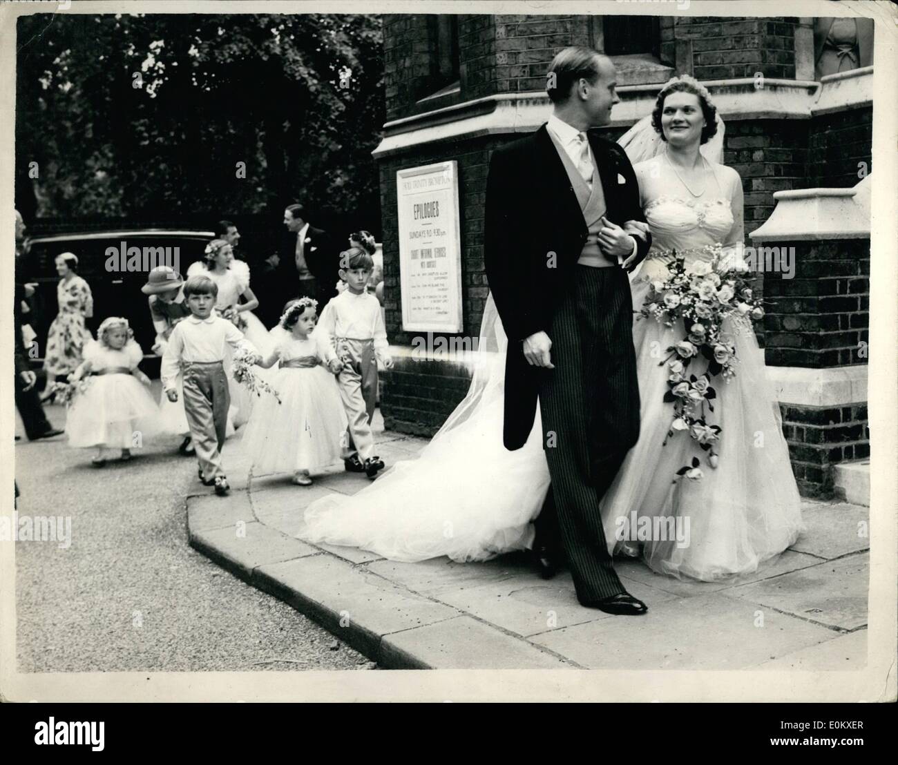 Jun. 06, 1952 - Lord Lymington Weds: The wedding took place today at Holy Trinity, Brompton, between 29 year old Viscount Lymington, son of the Earl of Portsmouth, of Kitale, Kenya, and Mrs. John How, of Arizona, U.S.A. and Miss Maureen Stanley, only daughter of Lt.Col. and Mrs. K.B. Stanley, of Kingston House, Princes Gat, London. Photo shows The bride and groom followed by the rtinue of bridesmaids and pges, after the ceremony. Stock Photo