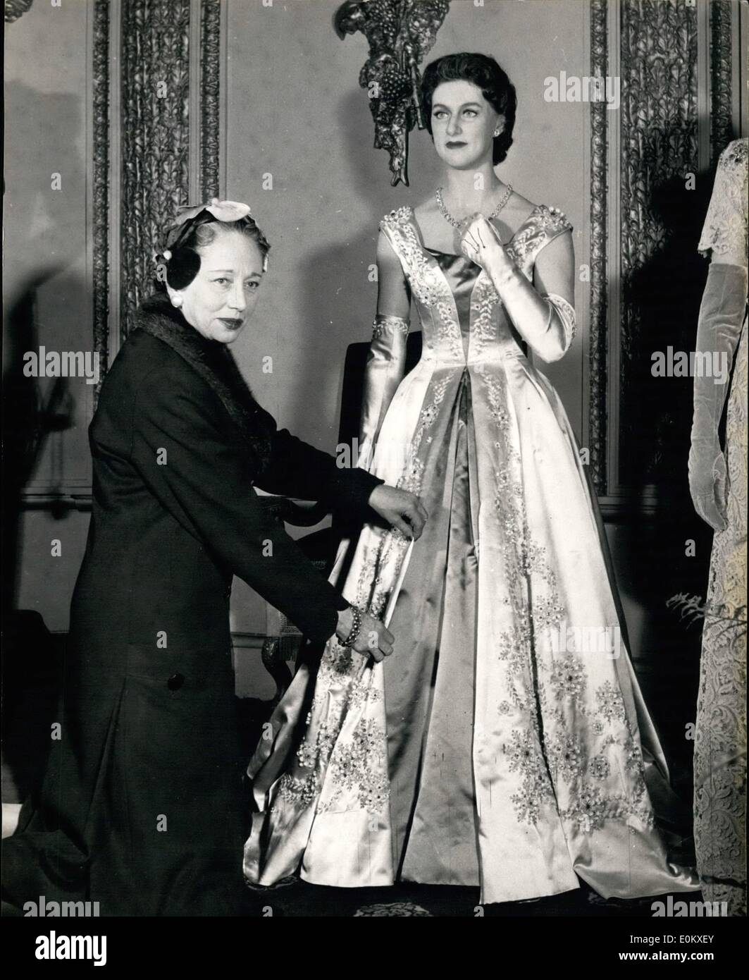 Jun. 06 1952 Princess Margaret s new wax effigy at Tussaud s Miss Denise of Norman Hartnell s adjusts the gown worn by the wax figure of H. R. R. Princess Margaret. which wear